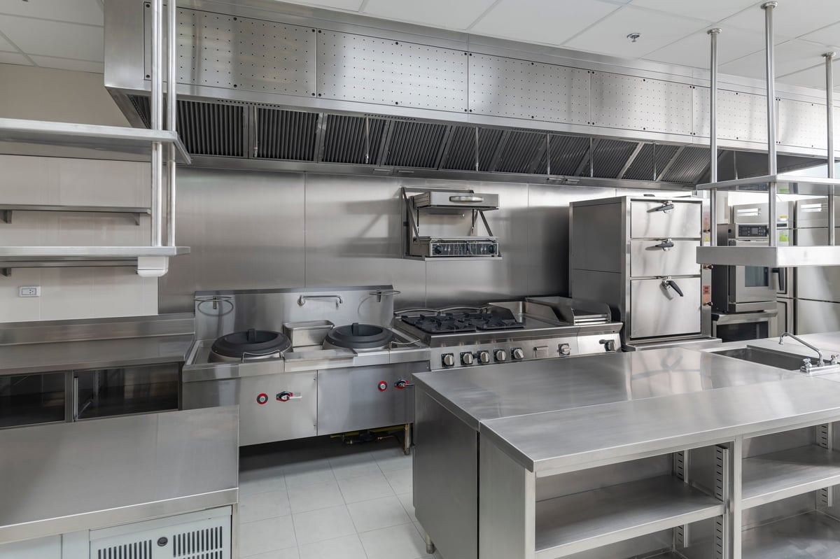A modern commercial kitchen fitted with professional stainless steel equipment, the kind of restaurant equipment CBB Group helps owners finance