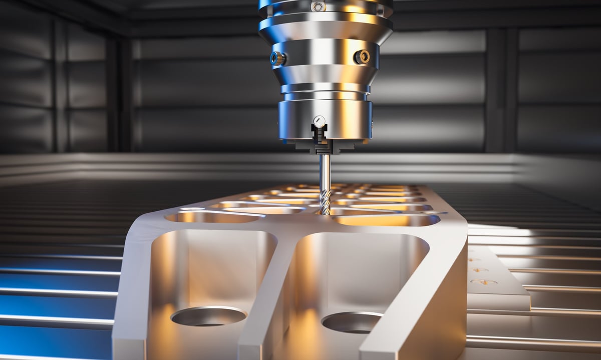 A CNC milling machine shaping a metal part in an industrial setting, the kind of precision manufacturing equipment CBB Group finances